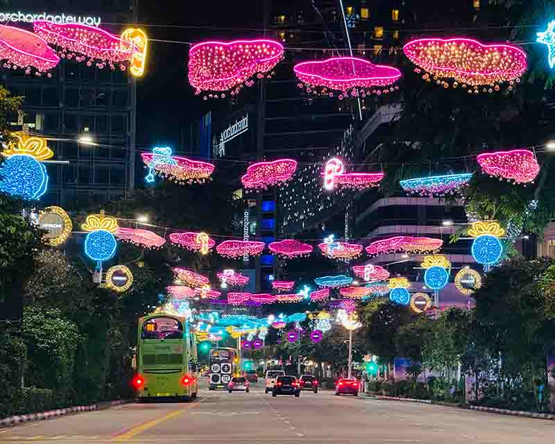 Orchard Road’s busy shopping district with luxury stores and bustling crowds.