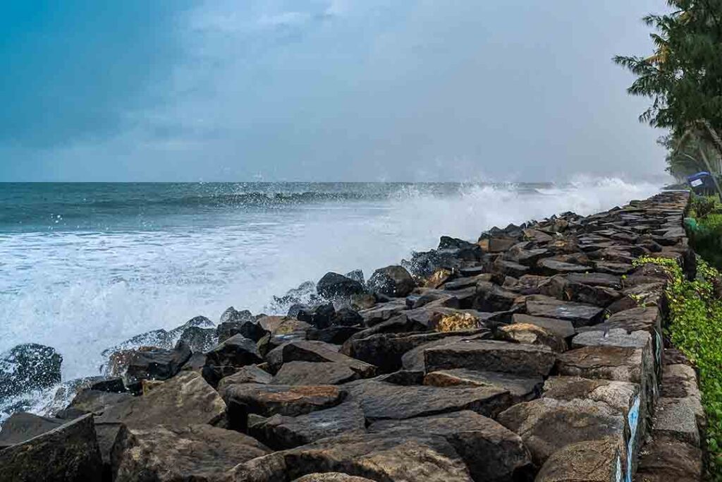 Rocks spotting at Cherai Beach, an attraction in the top beaches in Kerala, with tourists enjoying the sun